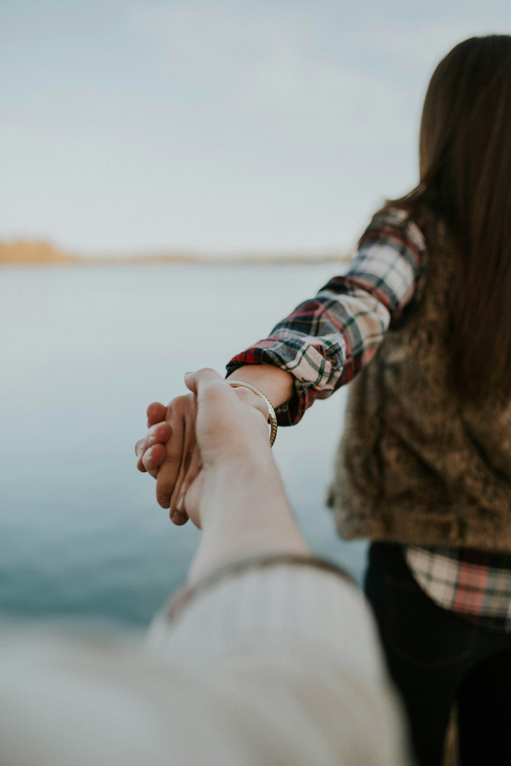 A couple holding hands.